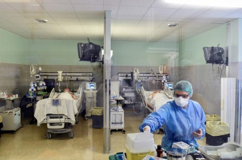 A medical worker wearing a protective mask and suit treats patients suffering from coronavirus disease (COVID-19) in an intensive care unit at the Oglio Po hospital in Cremona, Italy March 19, 2020. u00e2u20acu201d Reuters pic