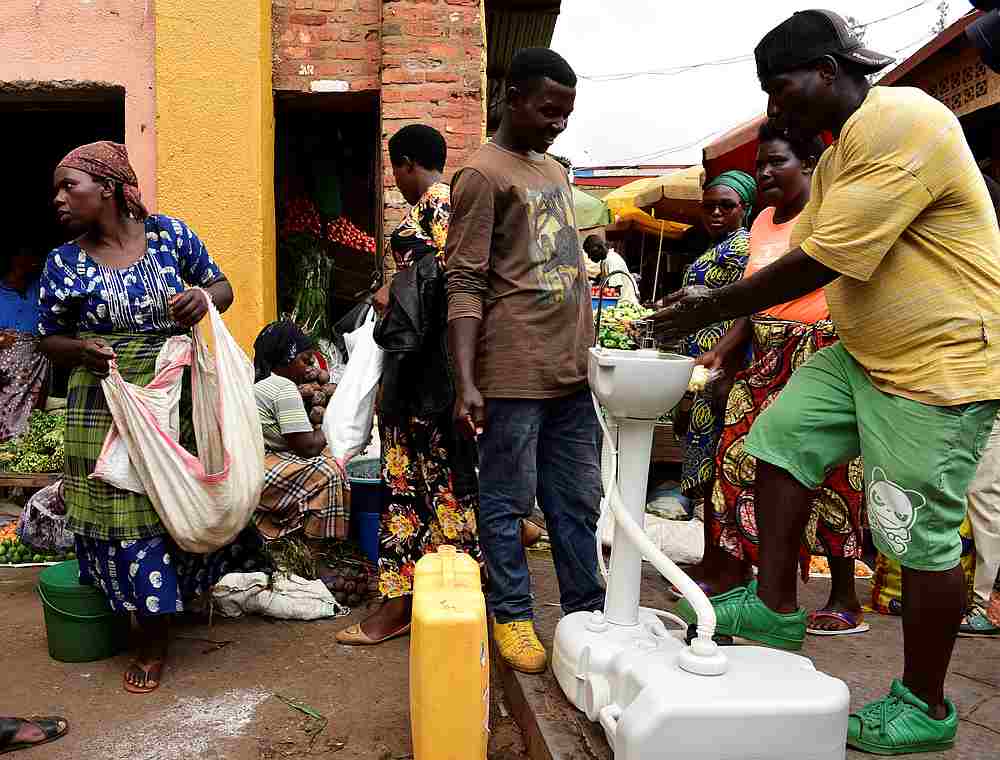 A man washes his hands at a public hand washing station before boarding a bus as a cautionary measure against the coronavirus at Nyabugogo Bus Park in Kigali, Rwanda March 11, 2020. u00e2u20acu201d Reuters pic