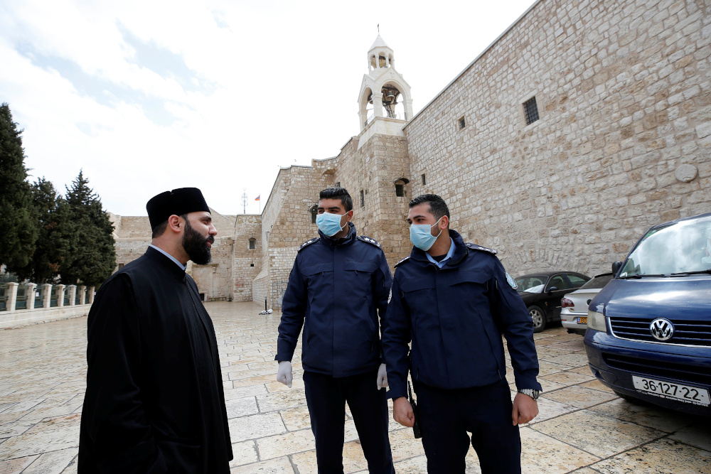 Palestinian police officers stand guard outside the Church of the Nativity that was closed as a preventive measure against the coronavirus, in Bethlehem in the Israeli-occupied West Bank March 6, 2020. u00e2u20acu201d Reuters pic 