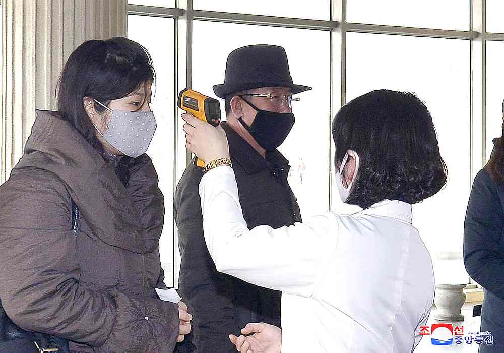 Volunteers carry out temperature screening during an anti-virus campaign in Pyongyang, North Korea  March 4, 2020. u00e2u20acu201d KCNA pic via Reuters