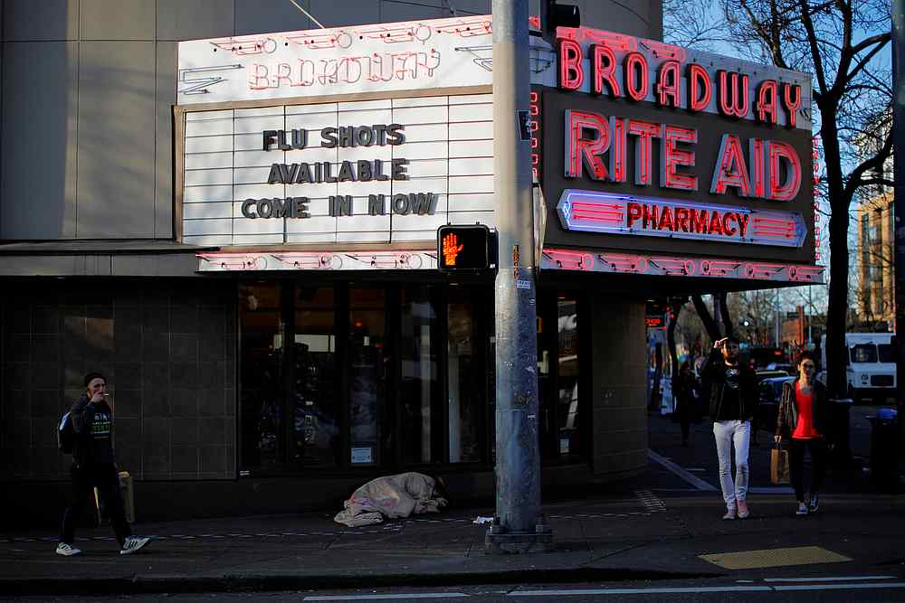 The sign over a drug store advertises flu shots amid the Covid-19 outbreak in Seattle, Washington, March 17, 2020. u00e2u20acu201d Reuters pic