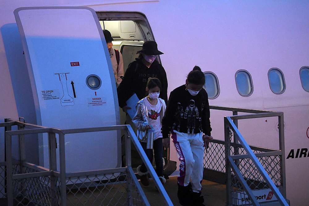 Australian evacuees who were quarantined on Christmas Island over concerns about the coronavirus disembark from a plane at Sydney Airport, Australia, February 17, 2020. u00e2u20acu201d Reuters pic