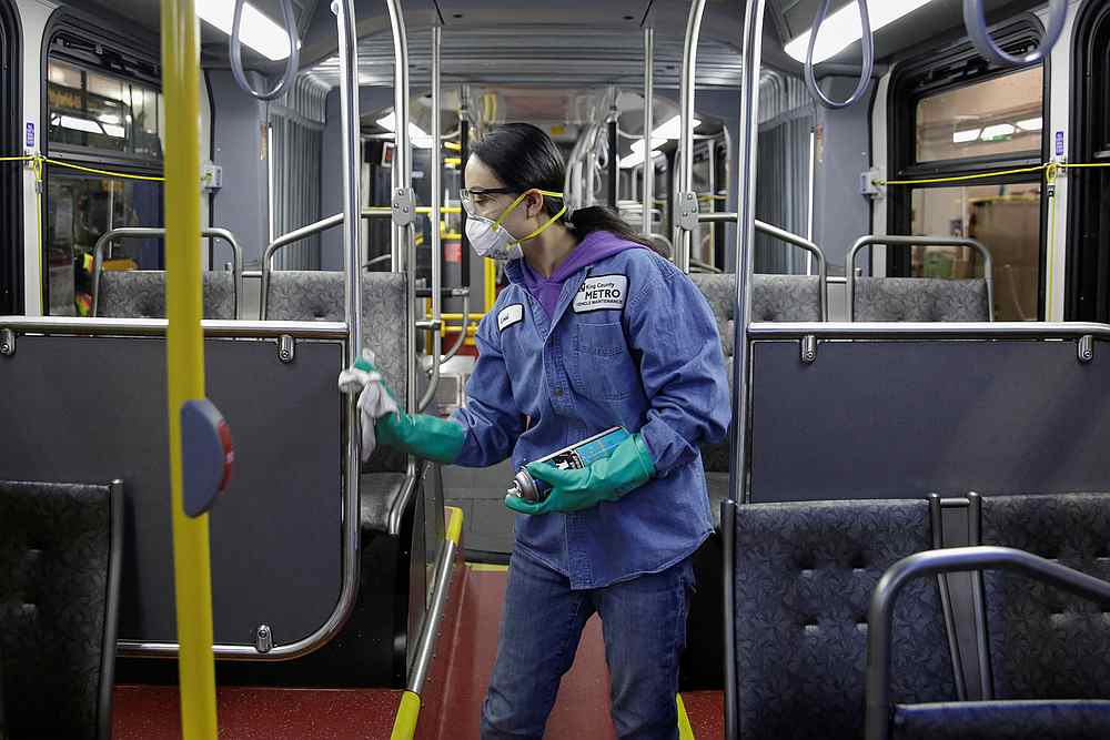 Vehicle maintenance Uworker Thiphavanh 'Loui' Thepvongsa wipes down a bus with a disinfectant at the King County Metro Atlantic and Central Base in Seattle, Washington March 2, 2020. u00e2u20acu201d Reuters pic