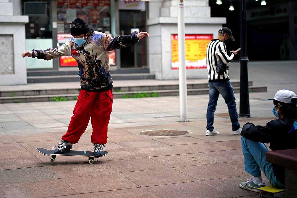 A man wearing a face mask skateboards on a street in Wuhan, Hubei province, China March 28, 2020. u00e2u20acu201d Reuters pic