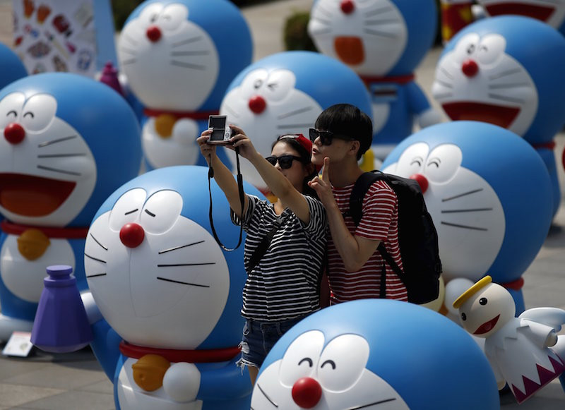 File picture of a couple snapping a selfie among Doraemon figures during an exhibition in Seoul August 31, 2015. u00e2u20acu201d Reuters pic