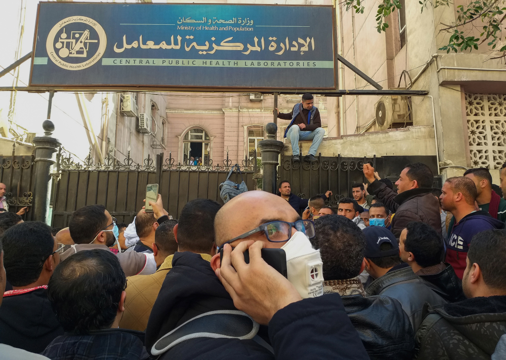 Egyptians bound for GCC countries gather in front of the Central Public Health Laboratories in downtown Cairo as they wait to get tested for coronavirus March 8, 2020. u00e2u20acu201d AFP pic 