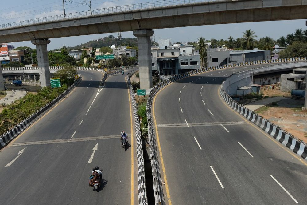 People on bikes ride along a deserted road during the first day of a 21-day government-imposed nationwide lockdown as a preventive measure against the COVID-19 coronavirus, in Chennai, India, March 25, 2020. u00e2u20acu201d AFP pic