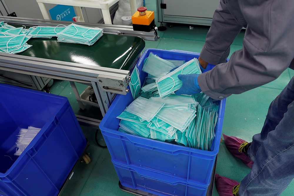 A worker works on a production line for prototype face masks at Mask Factory, following the Covid-19 outbreak, in Hong Kong February 19, 2020. u00e2u20acu201d Reuters pic