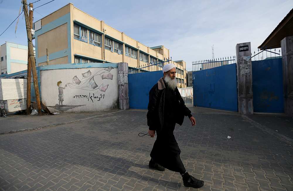 A Palestinian man walks past a United Nations-run school that was closed to students amid coronavirus precautions, in Khan Younis in the southern Gaza Strip March 9, 2020. u00e2u20acu201d Reuters pic