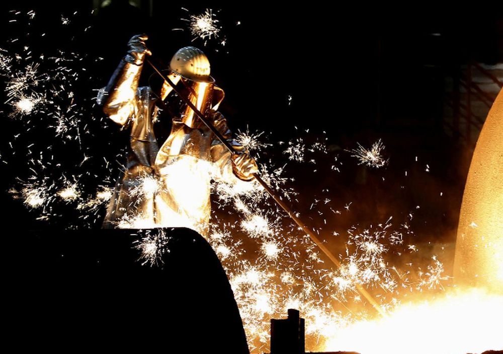A worker controls a tapping of a blast furnace at Europeu00e2u20acu2122s largest steel factory of Germanyu00e2u20acu2122s industrial conglomerate ThyssenKrupp AG in Duisburg, Germany December 6, 2012. u00e2u20acu201d Reuters pic