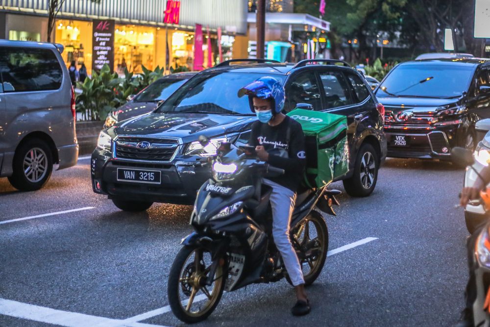 A GrabFood rider is pictured amid the Covid-19 outbreak in Kuala Lumpur 16, 2020. u00e2u20acu201d Picture by Firdaus Latif