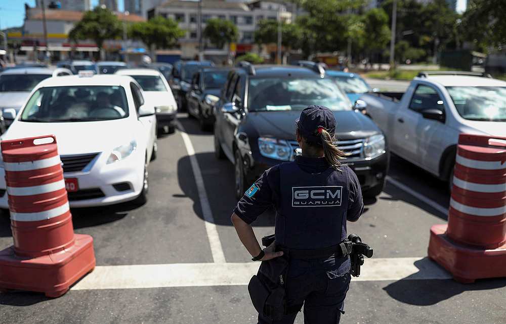 A police officer blocks the entrance of the ferry that crosses to Guaruja beaches, amid the coronavirus disease outbreak, in Santos, Sao Paulo state, Brazil March 22, 2020 u00e2u20acu201d Reuters pic