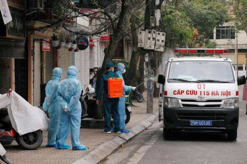 A health worker disinfects an ambulance near the house of a corona virus infected patient at a quarantined street in Hanoi, Vietnam March 7, 2020. u00e2u20acu201d Reuters pic