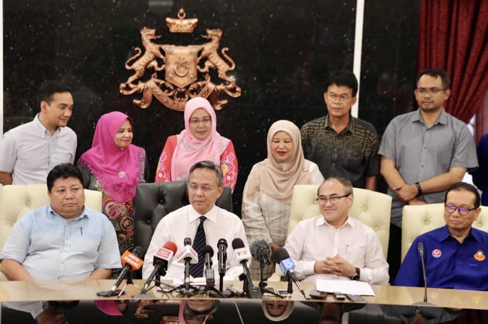 Newly-minted Johor Mentri Besar Datuk Hasni Mohammad (centre) hopes that the new exco line-up will take their oath of office this Friday. u00e2u20acu201d Picture by Ben Tan