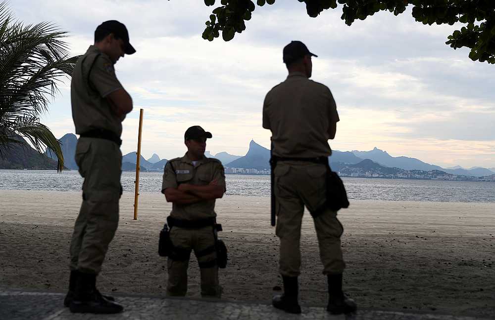 Municipal guards stand seen at the Icarai beach, banned for users during the Covid-19 outbreak, in Niteroi, Rio de Janeiro state, Brazil March 19, 2020. u00e2u20acu201d Reuters pic