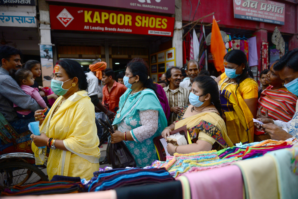 Members of the transgender community distribute free facemasks amid concerns over the spead of the Covid-19 coronavirus, at a market area in Allahabad March 19, 2020. u00e2u20acu201d AFP pic 