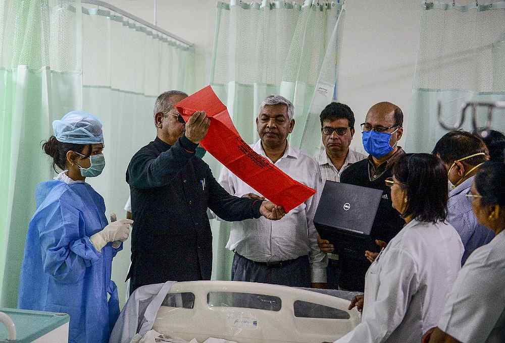 Health department officials and doctors participate in a mock drill practice with a mock patient at SRN Hospital, amid concerns over the spread of the Covid-19, in Allahabad March 18, 2020. u00e2u20acu201d AFP pic