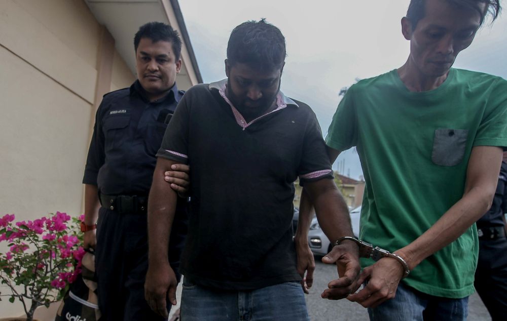 Punniamurthy Selvaraj (centre) was fined RM5,000 after pleading guilty at the Sungai Siput Magistrateu00e2u20acu2122s Court for obstructing a civil servant from carrying out his duties during Ops Covid-19. u00e2u20acu201d Picture by Farhan Najib