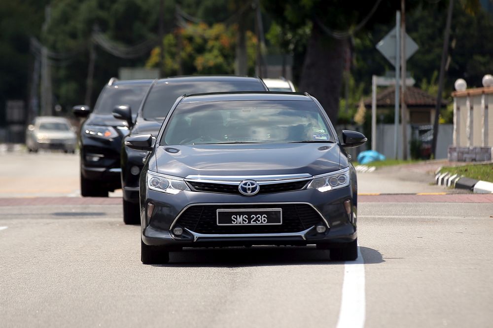 A vehicle ferrying Bersatu chairman Datuk Seri Ahmad Faizal Azumu arrives at Istana Kinta in Ipoh March 12, 2020. u00e2u20acu201d Picture by Farhan Najib