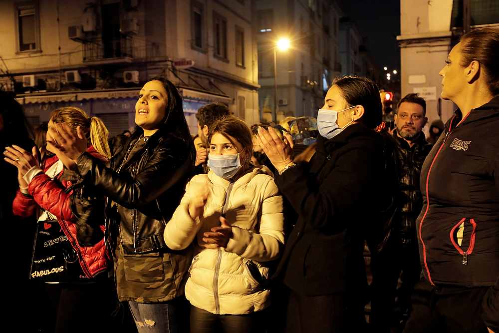Relatives of inmates, wearing protective face masks, gather outside Poggioreale prison in Naples, Italy, March 8, 2020. u00e2u20acu201d Reuters pic