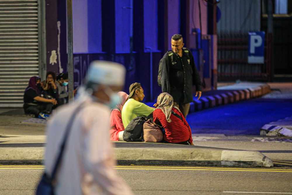 People are seen roaming around Jalan Tuanku Abdul Rahman despite the movement control order, March 19, 2020. u00e2u20acu2022 Picture by Hari Anggara