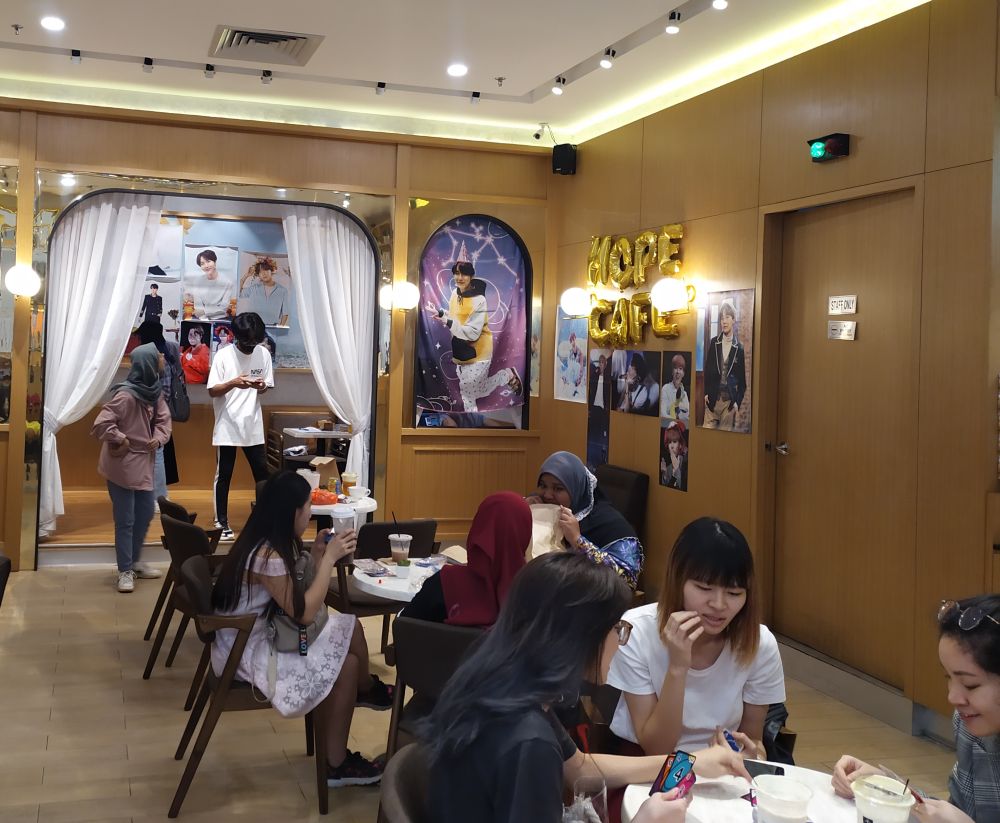Cafes are decked out with photos of K-pop singers during cupsleeve events and provide a haven where fans can socialise and bond over their shared love for an idol group. — Picture courtesy of Yvonne Chen