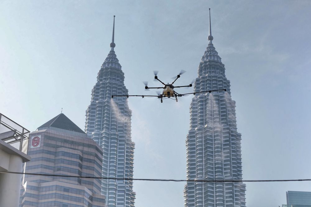 A drone is used to spray disinfectant in Kampung Baru to curb spread of Covid-19 in Kuala Lumpur March 31, 2020. u00e2u20acu201d Picture by Ahmad Zamzahuri
