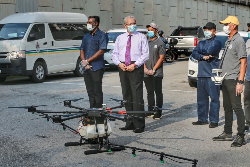 Federal Territories minister Tan Sri Annuar Musa is pictured during disinfection work in Kampung Baru, Kuala Lumpur March 31, 2020. u00e2u20acu201d Picture by Ahmad Zamzahuri