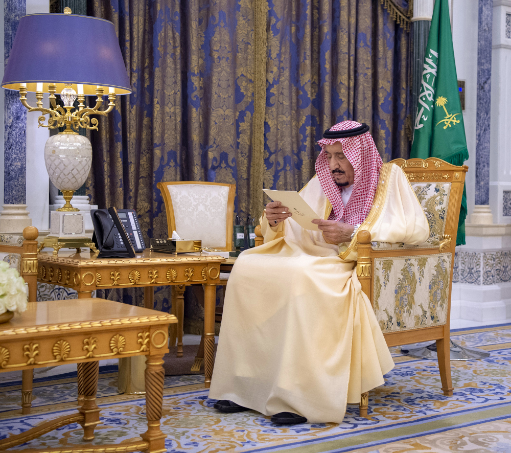 A handout picture provided by the Saudi Royal Palace March 8, 2020, shows Saudi Arabiau00e2u20acu2122s King Salman bin Abdulaziz reading documents at the Royal Palace in the capital Riyadh. u00e2u20acu201d Saudi Royal Palace/Bandar Al-Jaloud handout pic via AFP  
