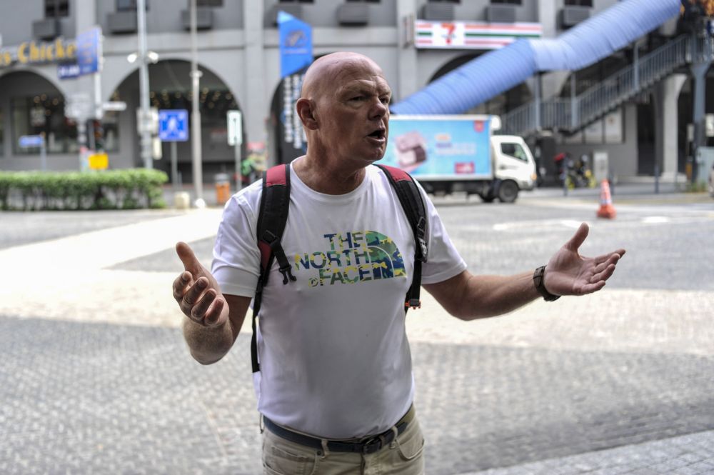 Alan from England loves the warm weather in Malaysia but has had to cut his holiday short. — Picture by Shazwan Zaidon