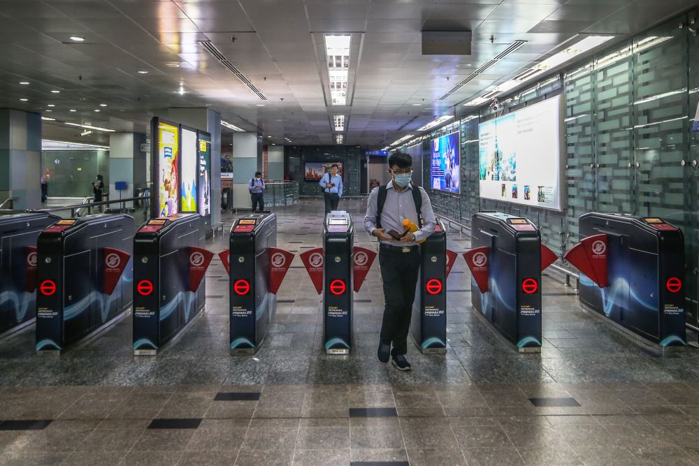 Commuters wearing face masks are pictured at the KLCC LRT station in Kuala Lumpur March 18, 2020. u00e2u20acu201d Picture by Firdaus Latif