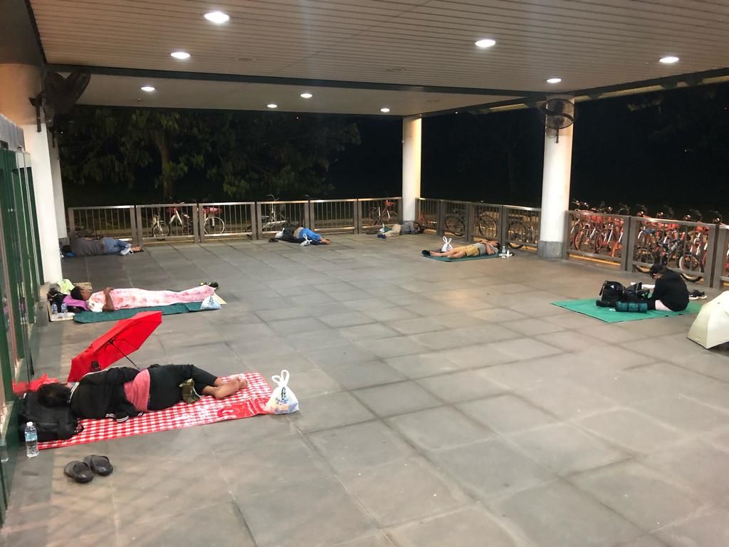 At least 20 Malaysian workers were seen sleeping behind the gates of Kranji MRT Station on March 18, 2020. u00e2u20acu201d TODAY pic