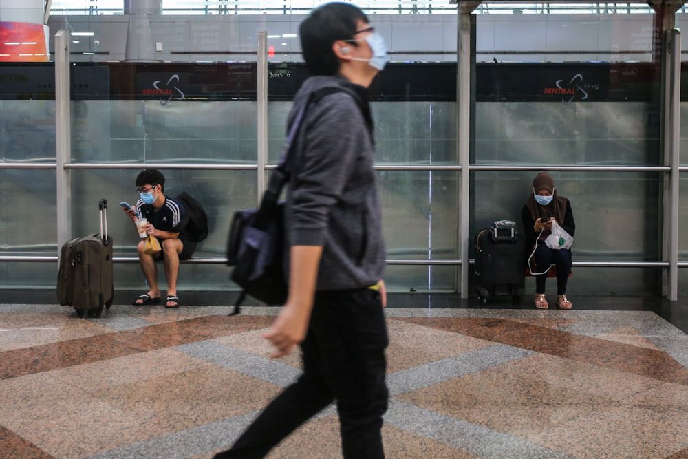 Commuters wearing face masks are pictured at the KL Sentral public transportation hub in Kuala Lumpur March 18, 2020. u00e2u20acu201d Picture by Hari Anggara