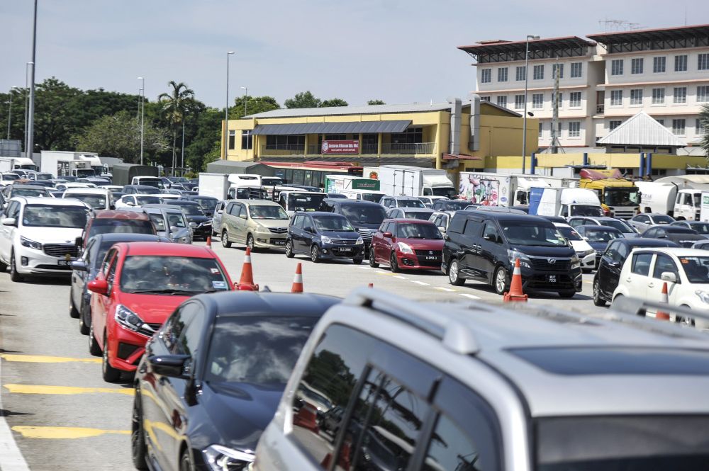 Heavy traffic is seen along the LDP on day seven of the movement control order in Petaling Jaya March 24, 2020. u00e2u20acu201d Picture by Shafwan Zaidon