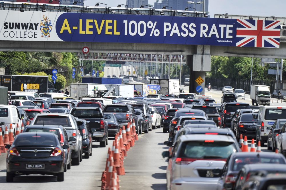 Heavy traffic is seen along the LDP on day seven of the movement control order in Petaling Jaya March 24, 2020. u00e2u20acu201d Picture by Shafwan Zaidon