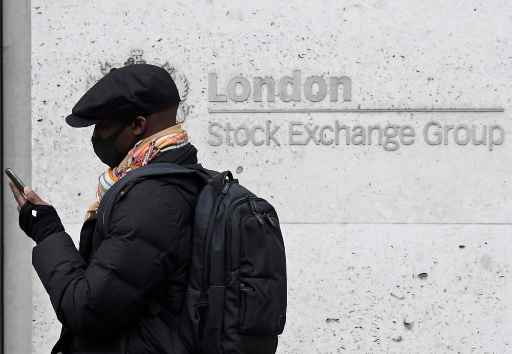 A man wearing a protective face mask walks past the London Stock Exchange Group building in London. u00e2u20acu2022 Reuters pic
