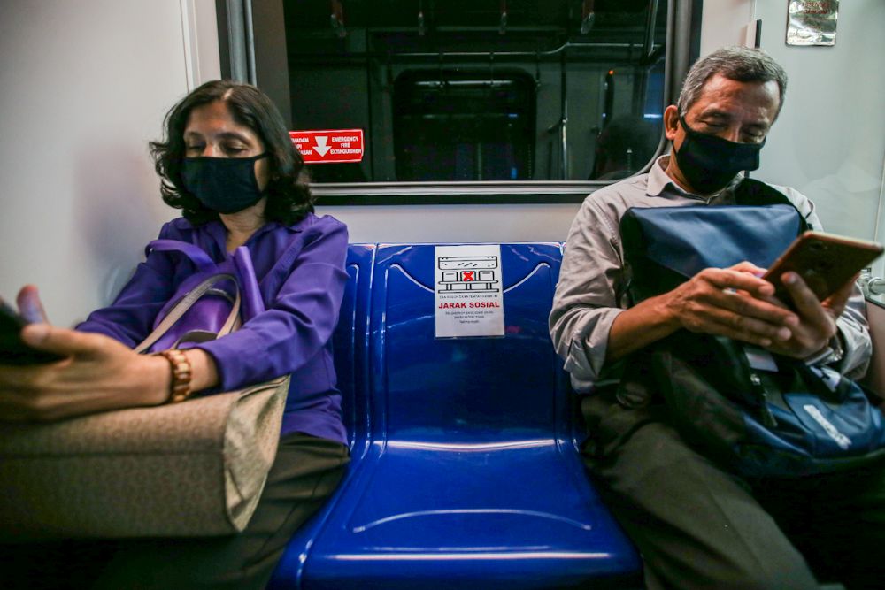 Passengers heed Prasaranau00e2u20acu2122s social distancing advice on board an LRT train March 24, 2020. u00e2u20acu201d Picture by Hari Anggara