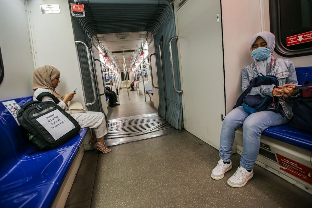 Passengers heed Prasaranau00e2u20acu2122s social distancing advice on board an LRT train March 24, 2020. u00e2u20acu201d Picture by Hari Anggara