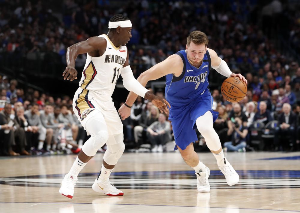 Dallas Mavericks guard Luka Doncic (77) drives to the basket past New Orleans Pelicans guard Jrue Holiday (11) during the second quarter at American Airlines Centre.  u00e2u20acu201d Reuters pic