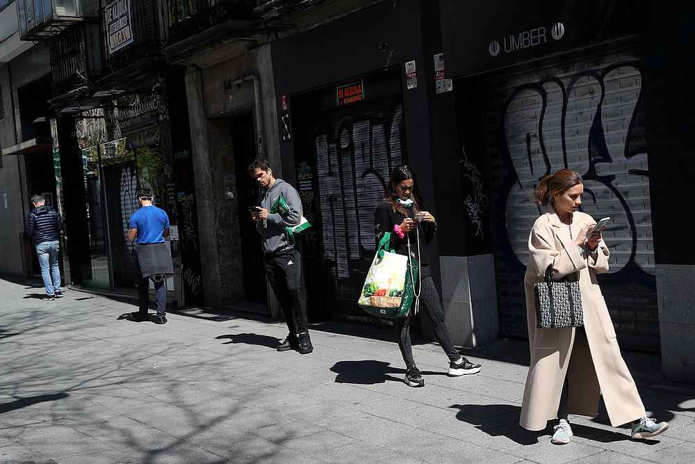 People practise social distancing as they wait to enter a supermarket during the Covid-19 outbreak in Madrid, Spain March 29, 2020. u00e2u20acu201d Reuters pic 