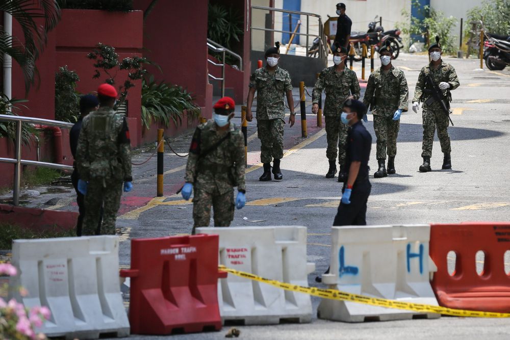 Armed Forces personnel patrol the vicinity of Menara City One in Kuala Lumpur March 31, 2020. u00e2u20acu201d Picture by Yusof Mat Isa