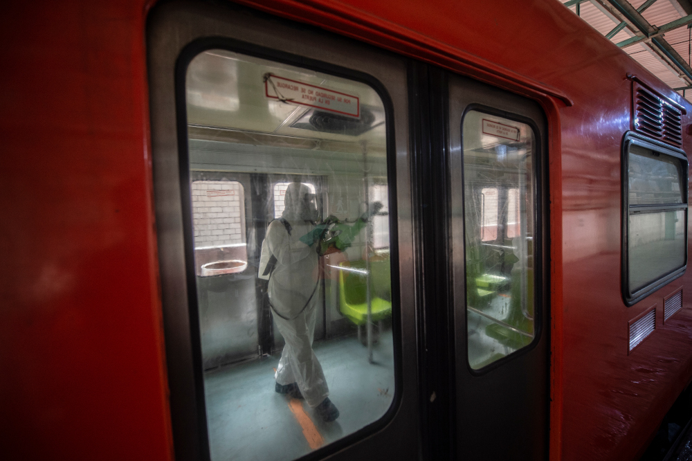 A worker disinfects a metro wagon in Mexico City, March 18, 2020, as a preventive measure against the spread of the new coronavirus. u00e2u20acu201d AFP pic 