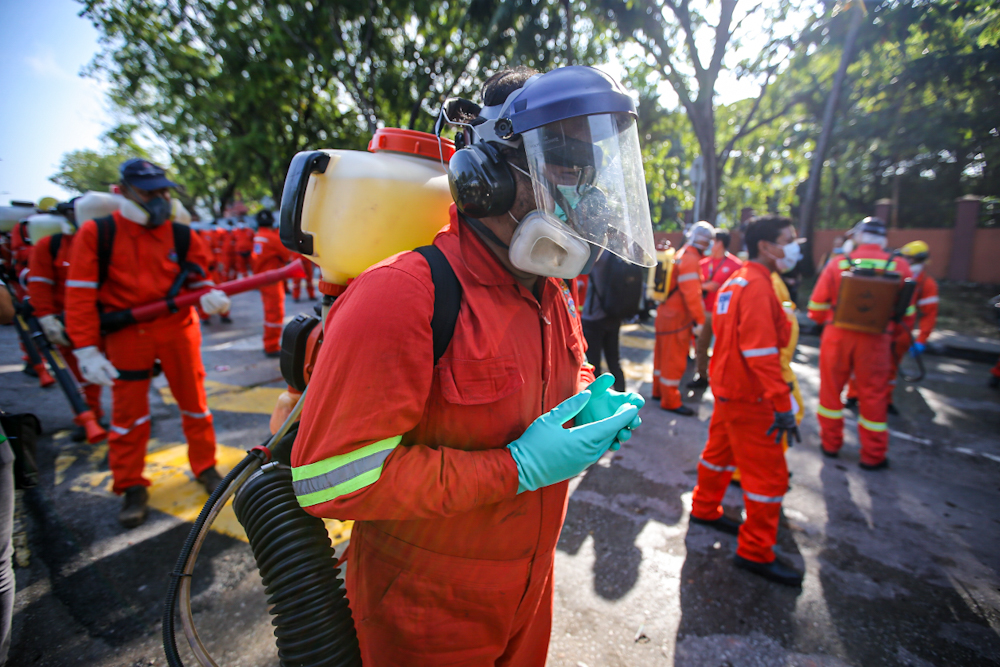 DBKL and Alam Flora personnel prepare to sanitise the area around the Sri Petaling Mosque March 28, 2020. u00e2u20acu2022 Picture by Hari Anggara