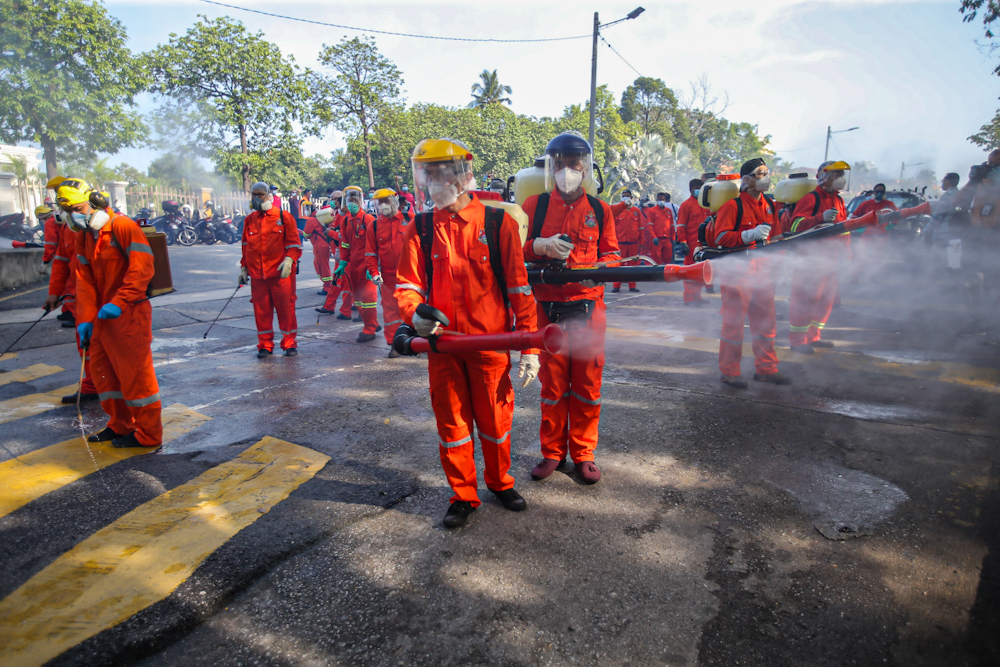 DBKL and Alam Flora personnel sanitise the area around the Sri Petaling Mosque March 28, 2020. u00e2u20acu2022 Picture by Hari Anggara