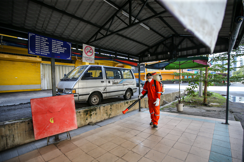 DBKL and Alam Flora personnel sanitise the area around the Sri Petaling Mosque March 28, 2020. ― Picture by Hari Anggara