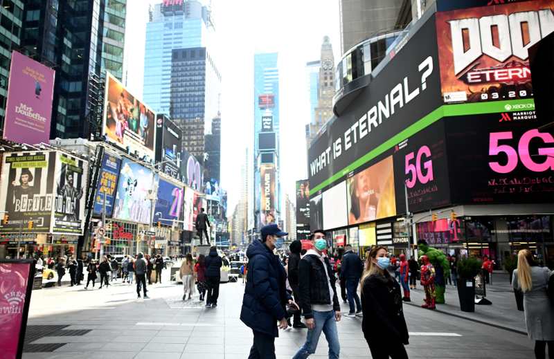 People wearing masks enjoy the sun at Times Square on March 14, 2020 in New York City. u00e2u20acu2022 AFP pic
