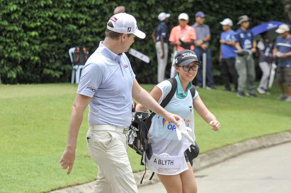 Nicole and Adam Blyth are one of the happiest looking couples on course.
