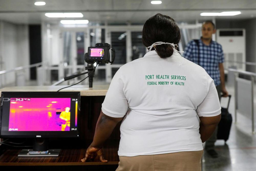 An official monitors thermal scanners as a passenger walks past upon arrival of a flight into Lagos, Nigeria January 22, 2020. u00e2u20acu201d Reuters pic