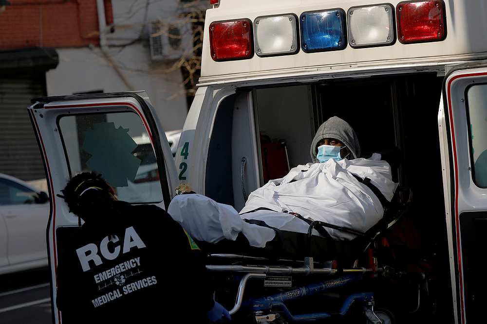 A patient is put into an ambulance as health workers continue to test people for Covid-19 outside the Brooklyn Hospital Center in New York March 27, 2020. u00e2u20acu201d Reuters pic