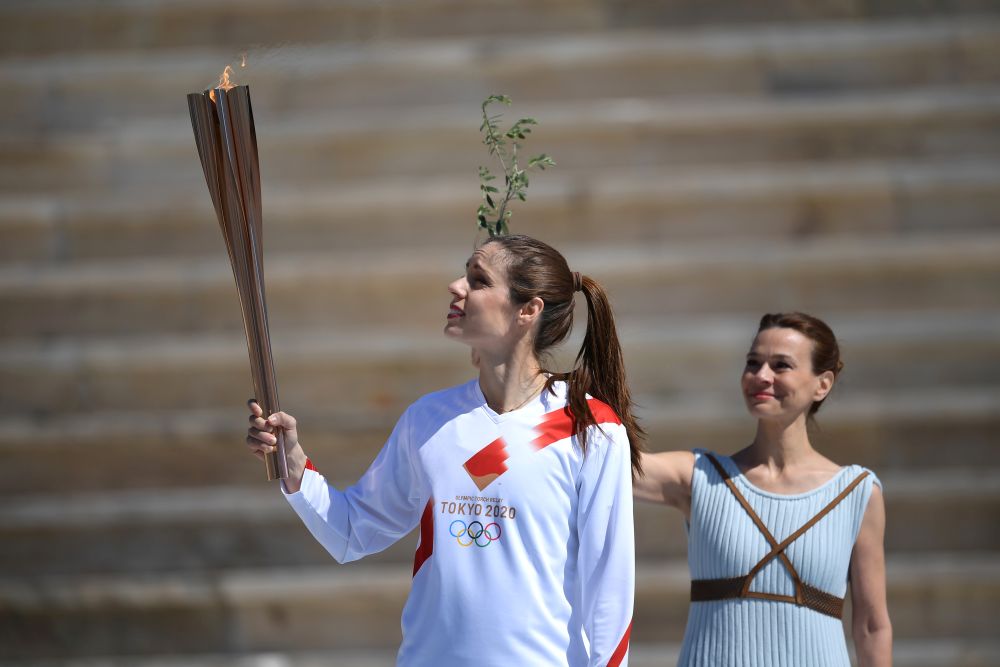 An athlete carries the olympic torch during the olympic flame handover ceremony for the 2020 Tokyo Summer Olympics March 19, 2020. u00e2u20acu201d Reuters pic